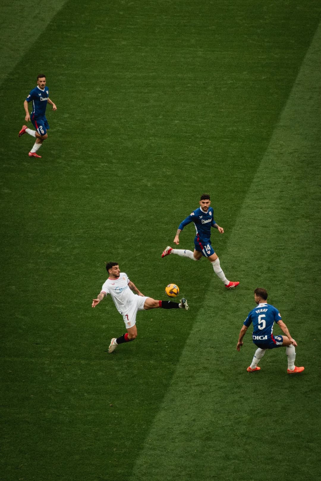 Sevilla stretching for a loose ball