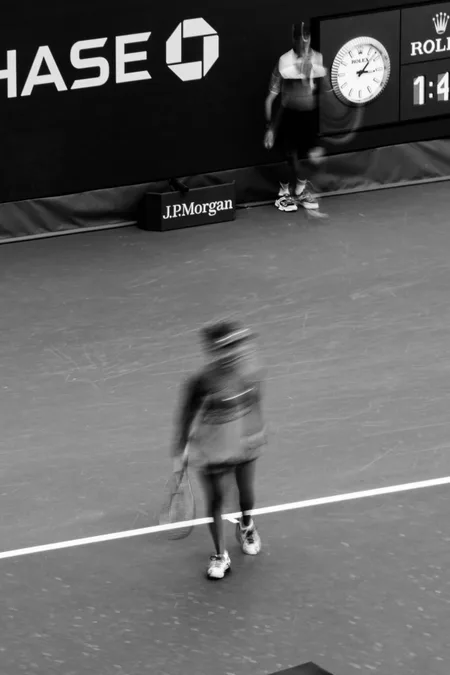 Walking back to the baseline in black and white