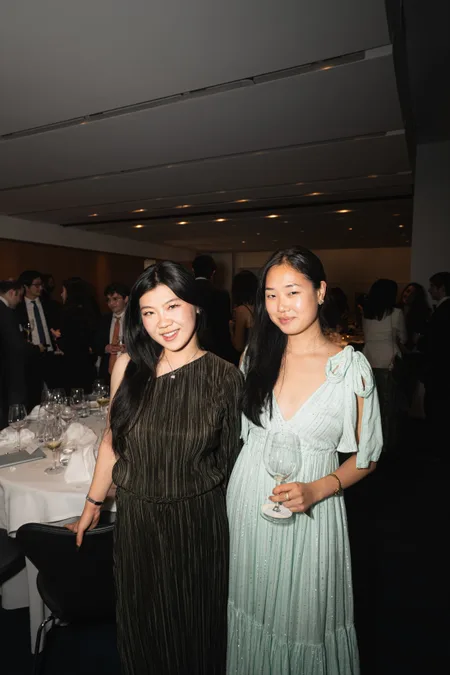 Two guests in evening dress at a reception