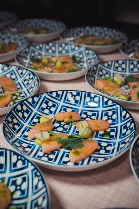 Crudo plated on blue and white ceramics