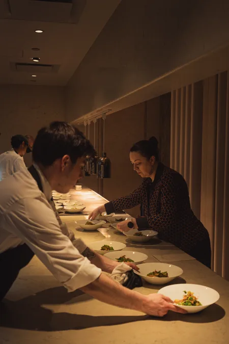 Kitchen sending plates down the pass