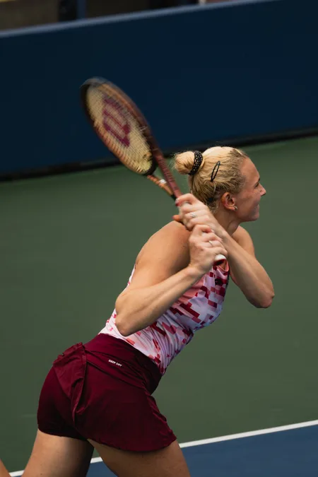 Kateřina Siniaková following through on a two-handed backhand