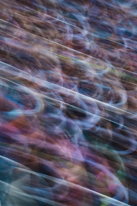 Stadium seating pulled into diagonal streaks by camera movement