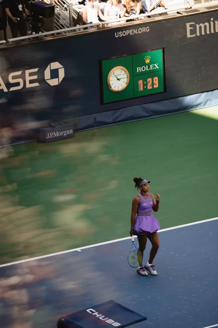 A player between points beneath the Rolex clock at the US Open
